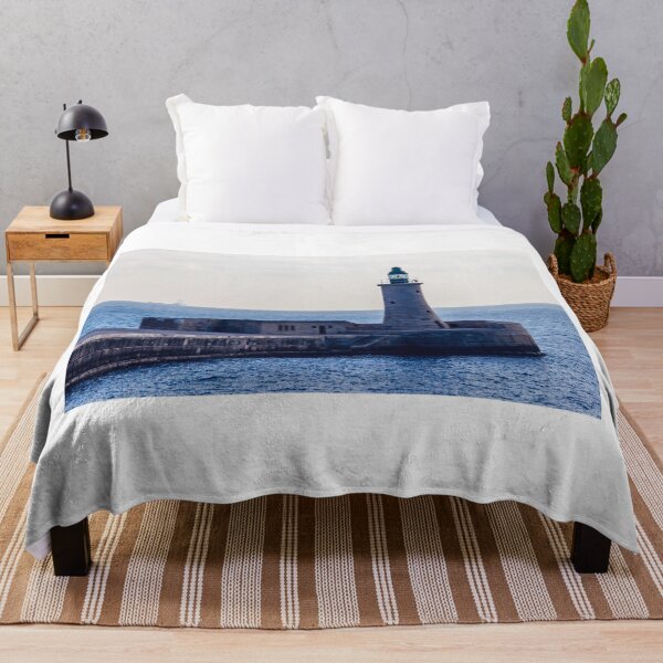 Item preview, Solitary Lighthouse on Stone Breakwater Overlooking Calm Blue Sea at Harbor Entrance With Distant Ship designed and sold by Nmallia.