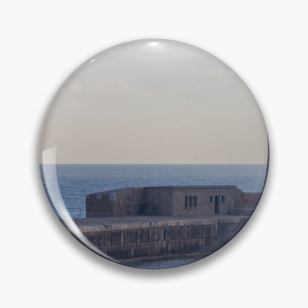 Item preview, Solitary Lighthouse on Stone Breakwater Overlooking Calm Blue Sea at Harbor Entrance With Distant Ship designed and sold by Nmallia.