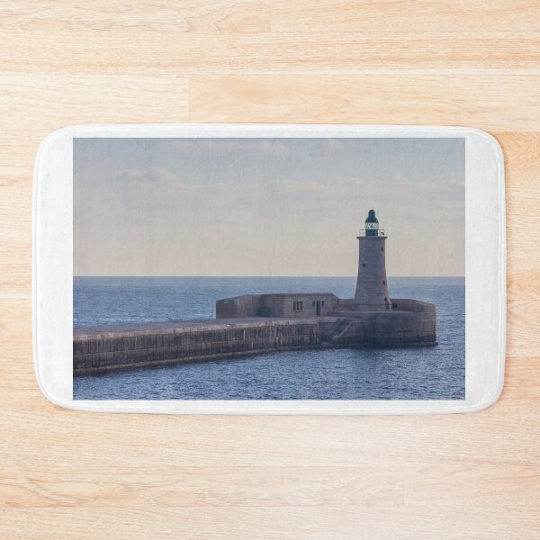Item preview, Solitary Lighthouse on Stone Breakwater Overlooking Calm Blue Sea at Harbor Entrance With Distant Ship designed and sold by Nmallia.