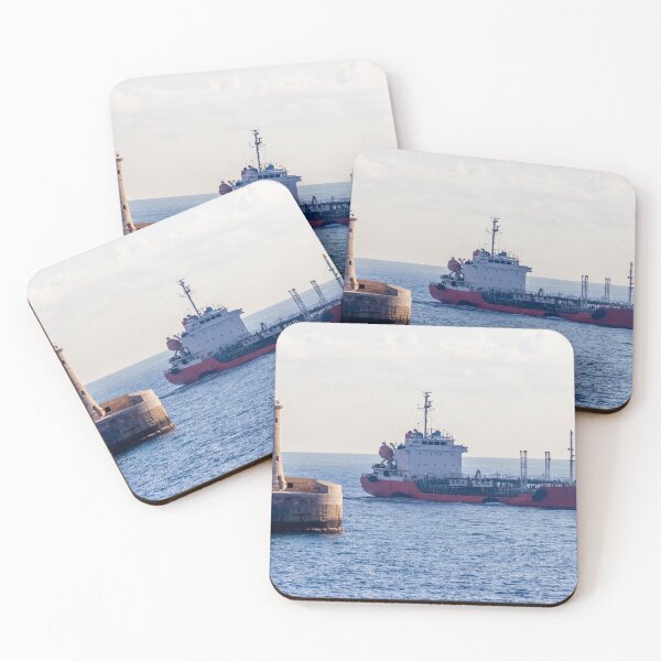 Item preview, Lighthouse Guarding Harbor Entrance as Cargo Ship Passes Along Coastal Waters at Sea designed and sold by Nmallia.