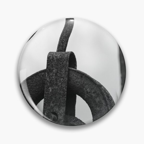 Item preview, Rusty Metal Pulley And Hook Hanging From Vintage Industrial Iron Bracket, Black And White Close-Up designed and sold by Nmallia.