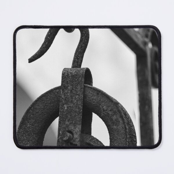 Item preview, Rusty Metal Pulley And Hook Hanging From Vintage Industrial Iron Bracket, Black And White Close-Up designed and sold by Nmallia.