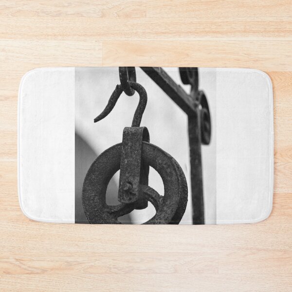 Item preview, Rusty Metal Pulley And Hook Hanging From Vintage Industrial Iron Bracket, Black And White Close-Up designed and sold by Nmallia.
