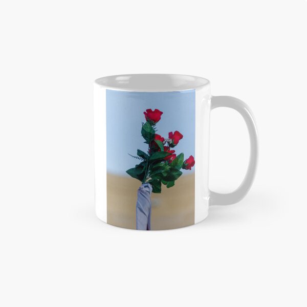 Item preview, Red Rose Bouquet Against Soft Blue Sky With Green Leaves and Wrapped Stem, Romantic Floral Close-Up designed and sold by Nmallia.