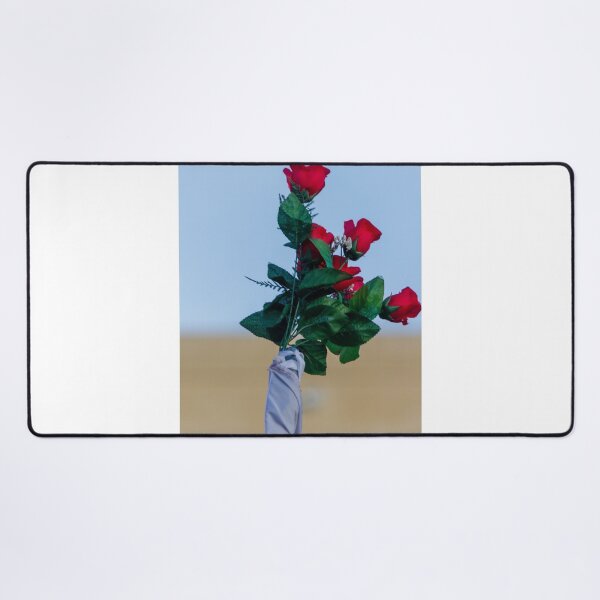 Item preview, Red Rose Bouquet Against Soft Blue Sky With Green Leaves and Wrapped Stem, Romantic Floral Close-Up designed and sold by Nmallia.