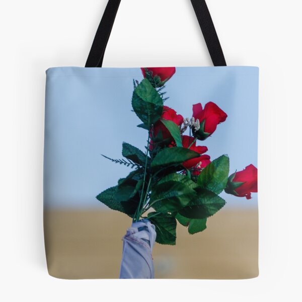 Item preview, Red Rose Bouquet Against Soft Blue Sky With Green Leaves and Wrapped Stem, Romantic Floral Close-Up designed and sold by Nmallia.