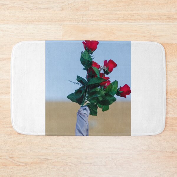 Item preview, Red Rose Bouquet Against Soft Blue Sky With Green Leaves and Wrapped Stem, Romantic Floral Close-Up designed and sold by Nmallia.