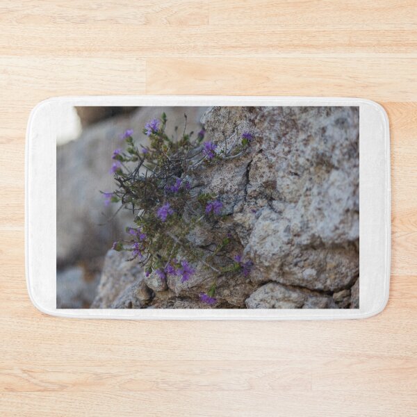 Item preview, Purple Wildflowers Growing From a Rocky Crevice on Limestone Cliff Close-Up Showing Resilience designed and sold by Nmallia.
