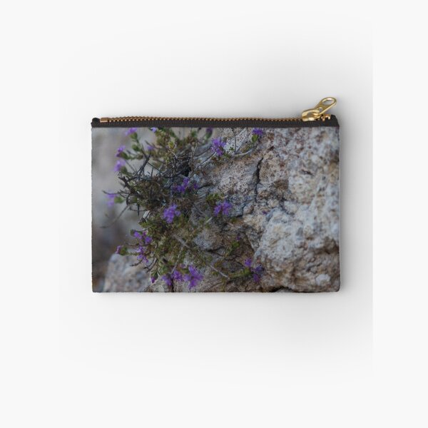 Item preview, Purple Wildflowers Growing From a Rocky Crevice on Limestone Cliff Close-Up Showing Resilience designed and sold by Nmallia.