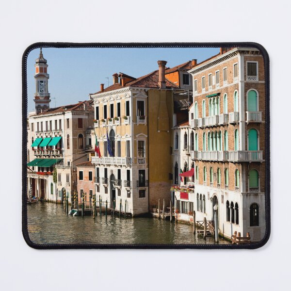 Item preview, Gondolas glide along the canal in Venice surrounded by vibrant buildings under a clear sky. designed and sold by Kevin Miller Photography.