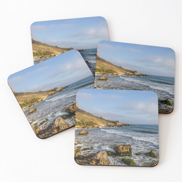 Item preview, Rocky Coastal Beach With Cliffs, Waves and Moss-Covered Boulders Under Blue Sky designed and sold by Nmallia.