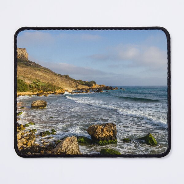 Item preview, Rocky Coastal Beach With Cliffs, Waves and Moss-Covered Boulders Under Blue Sky designed and sold by Nmallia.
