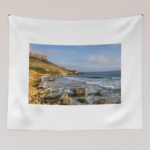 Item preview, Rocky Coastal Beach With Cliffs, Waves and Moss-Covered Boulders Under Blue Sky designed and sold by Nmallia.