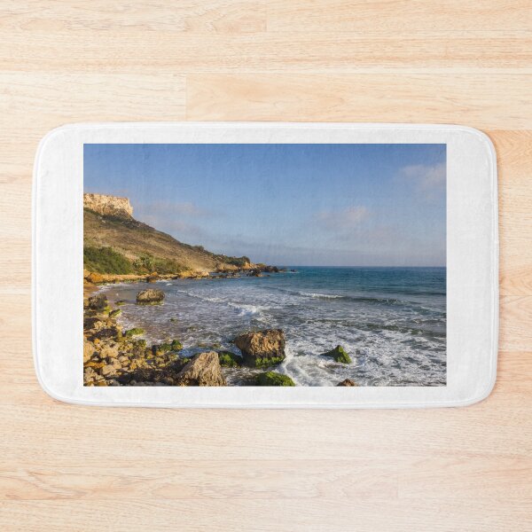 Item preview, Rocky Coastal Beach With Cliffs, Waves and Moss-Covered Boulders Under Blue Sky designed and sold by Nmallia.