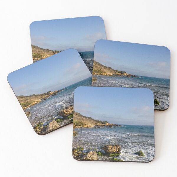 Item preview, Rocky Coastal Beach With Cliffs, Waves and Moss-Covered Boulders Under Blue Sky designed and sold by Nmallia.