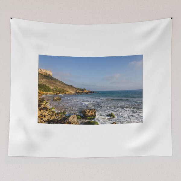 Item preview, Rocky Coastal Beach With Cliffs, Waves and Moss-Covered Boulders Under Blue Sky designed and sold by Nmallia.
