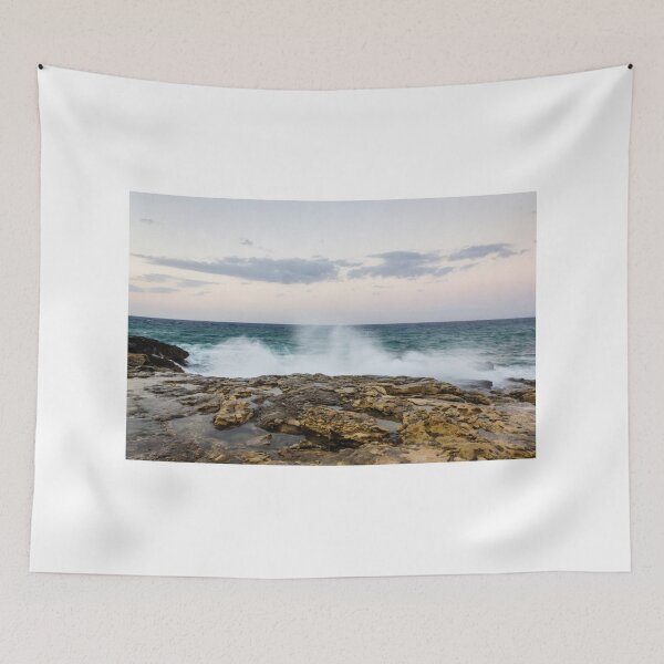 Item preview, Ocean Waves Crashing Against Rocky Shore At Dusk With Pastel Sky And Distant Horizon designed and sold by Nmallia.