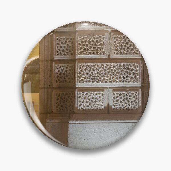 Item preview, Illuminated Historic Stone Wall With Ornate Carved Blocks And Glass Entrance At Night designed and sold by Nmallia.