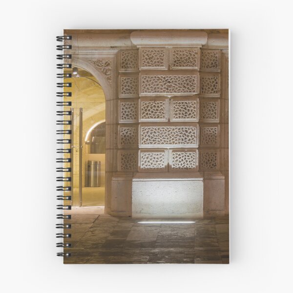 Item preview, Illuminated Historic Stone Wall With Ornate Carved Blocks And Glass Entrance At Night designed and sold by Nmallia.