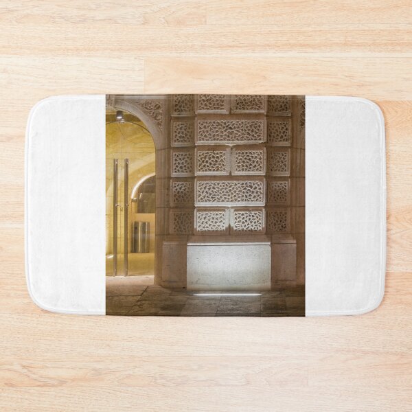 Item preview, Illuminated Historic Stone Wall With Ornate Carved Blocks And Glass Entrance At Night designed and sold by Nmallia.