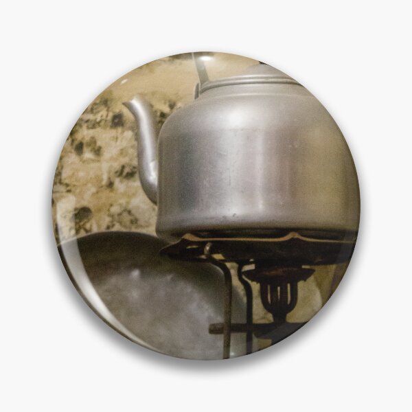 Item preview, Vintage Aluminum Kettle on Brass Camp Stove With Iron and Pan Against Rustic Stone Wall designed and sold by Nmallia.