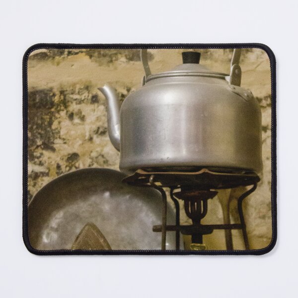 Item preview, Vintage Aluminum Kettle on Brass Camp Stove With Iron and Pan Against Rustic Stone Wall designed and sold by Nmallia.