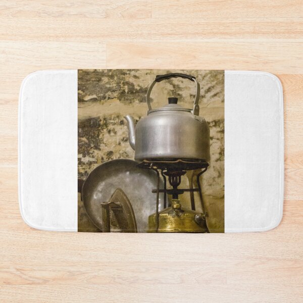 Item preview, Vintage Aluminum Kettle on Brass Camp Stove With Iron and Pan Against Rustic Stone Wall designed and sold by Nmallia.
