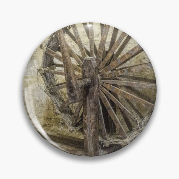 Item preview, Antique Wooden Spinning Wheel Against Stone Wall in Rustic Historic Workshop designed and sold by Nmallia.