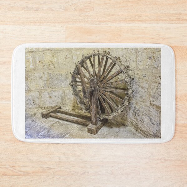 Item preview, Antique Wooden Spinning Wheel Against Stone Wall in Rustic Historic Workshop designed and sold by Nmallia.