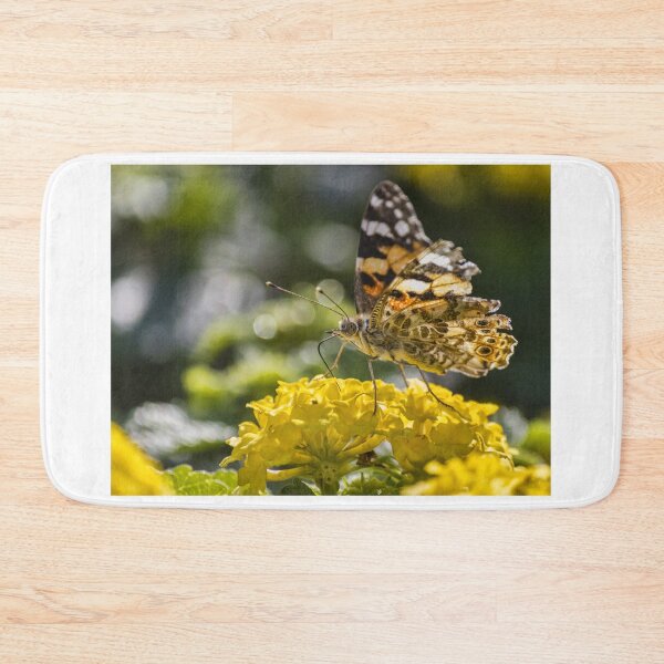 Item preview, Painted Lady Butterfly Feeding on Yellow Lantana Flower in Sunlit Garden Close-Up designed and sold by Nmallia.