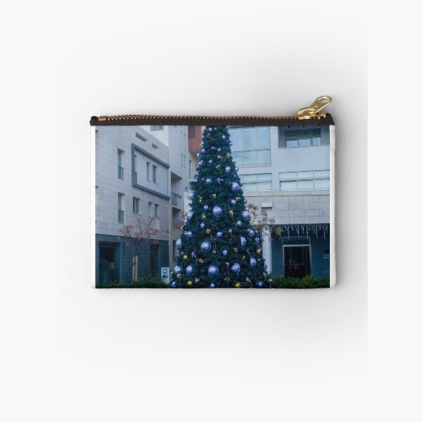 Item preview, Decorated Christmas Tree In Urban Plaza With Modern Apartment Buildings And Wet Pavement Reflections designed and sold by Nmallia.