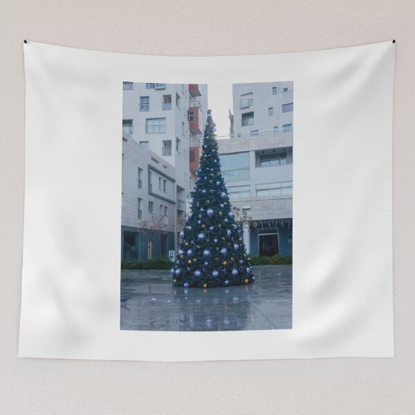 Item preview, Decorated Christmas Tree In Urban Plaza With Modern Apartment Buildings And Wet Pavement Reflections designed and sold by Nmallia.