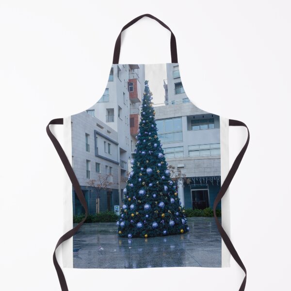 Item preview, Decorated Christmas Tree In Urban Plaza With Modern Apartment Buildings And Wet Pavement Reflections designed and sold by Nmallia.