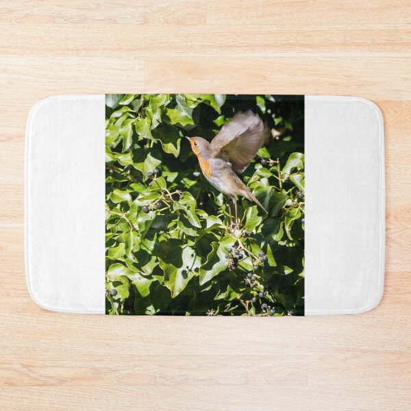 Item preview, European Robin Taking Flight Among Green Ivy Berries in Sunlit Garden Foliage designed and sold by Nmallia.