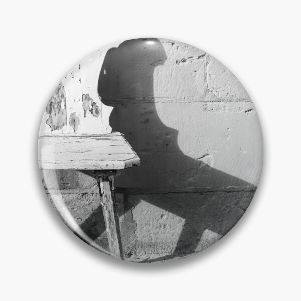 Item preview, Vintage Weathered Wooden Chair Casting Shadow Against Textured Stone Wall in Minimal Black and White designed and sold by Nmallia.