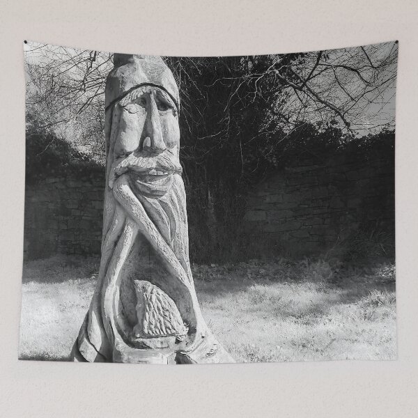 Item preview, Mystical Wood Spirit Tree Carving – Black and White Forest Sculpture Photography, Rustic Nature Art Print designed and sold by ivon55.