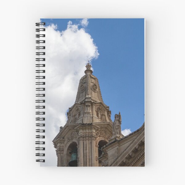 Item preview, Ornate Church Steeple and Bell Tower With Statue Against Blue Sky and Clouds designed and sold by Nmallia.