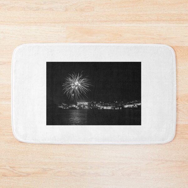 Item preview, Fireworks Over Historic Coastal City At Night With Water Reflection And Festive Skyline designed and sold by Nmallia.