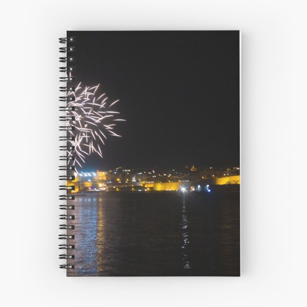 Item preview, Fireworks Over Coastal City At Night With Reflections On Calm Harbor Water And Illuminated Skyline designed and sold by Nmallia.