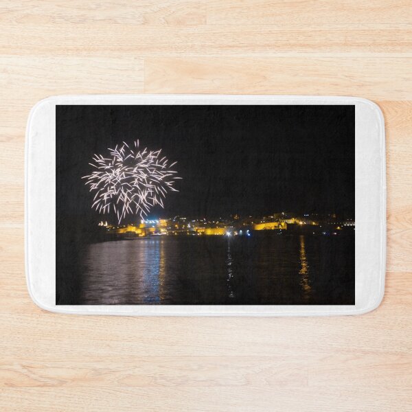 Item preview, Fireworks Over Coastal City At Night With Reflections On Calm Harbor Water And Illuminated Skyline designed and sold by Nmallia.