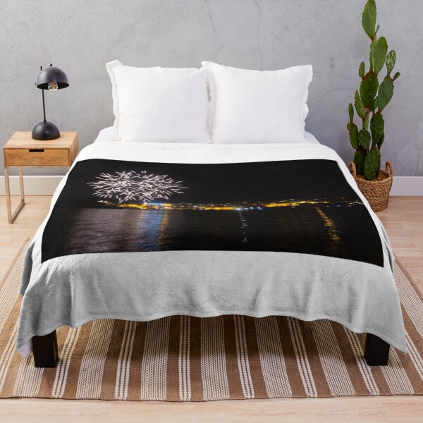Item preview, Fireworks Over Coastal City At Night With Reflections On Calm Harbor Water And Illuminated Skyline designed and sold by Nmallia.