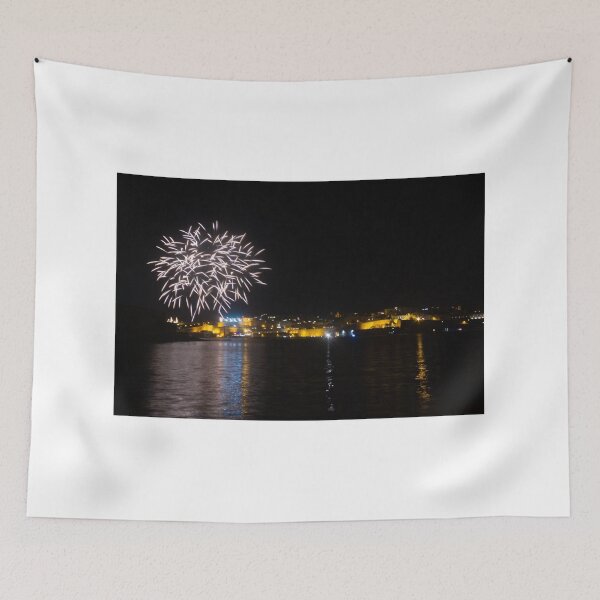 Item preview, Fireworks Over Coastal City At Night With Reflections On Calm Harbor Water And Illuminated Skyline designed and sold by Nmallia.