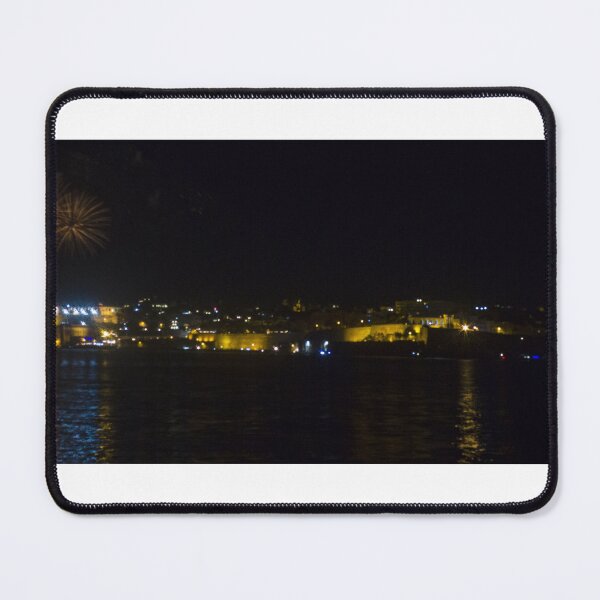 Item preview, Fireworks Over Coastal City At Night With Reflections On Calm Harbor Water And Illuminated Skyline designed and sold by Nmallia.