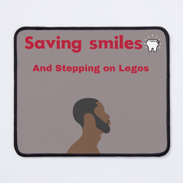 Item preview, Saving Smiles and Stepping on Legos T-shirt designed and sold by Soft Bloom Shop.