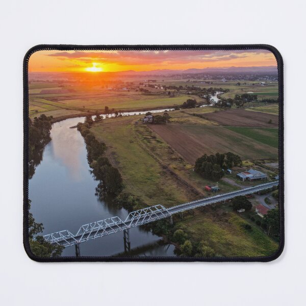 Item preview, Aerial view of a glowing sunset over rural farmland designed and sold by Justin Mckinney.