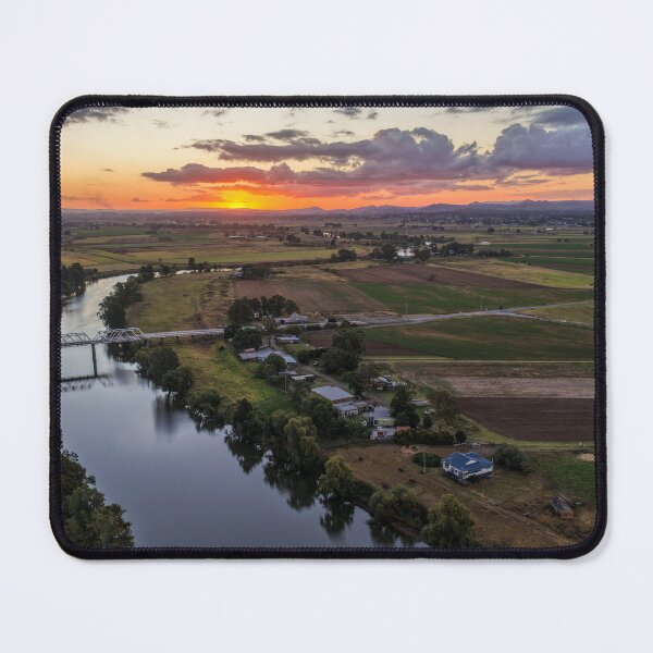 Item preview, Aerial view of a glowing sunset over rural farmland designed and sold by Justin Mckinney.