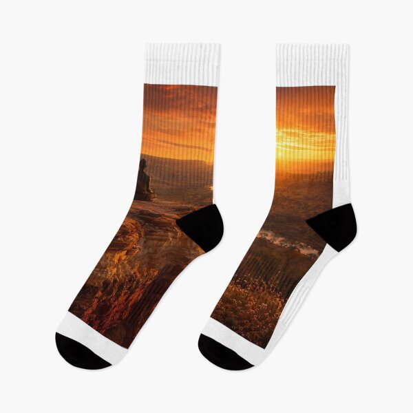 Item preview, "Lone Figure Lotus Meditation Ancient Terracotta Cliff Edge Blazing Sunset — River Valley Below Crescent Moon Wildflowers — Earth Tone Wellness Landscape Photography" designed and sold by Bossygraphicske.