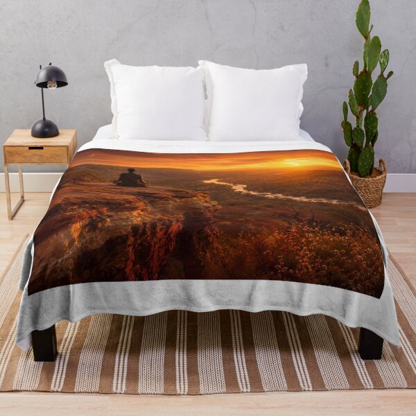 Item preview, "Lone Figure Lotus Meditation Ancient Terracotta Cliff Edge Blazing Sunset — River Valley Below Crescent Moon Wildflowers — Earth Tone Wellness Landscape Photography" designed and sold by Bossygraphicske.