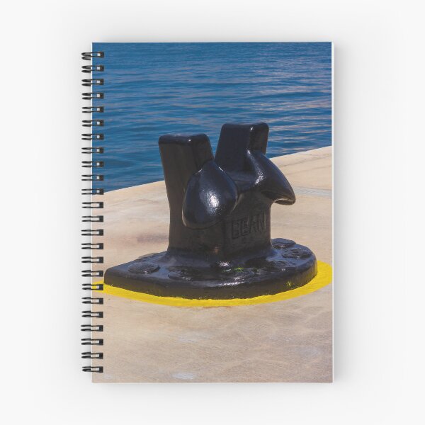 Item preview, Black Mooring Bollard On Concrete Pier By Blue Harbor Water With Yellow Painted Base designed and sold by Nmallia.