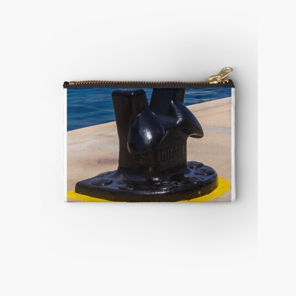 Item preview, Black Mooring Bollard On Concrete Pier By Blue Harbor Water With Yellow Painted Base designed and sold by Nmallia.